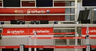 An empty Air Berlin check-in desk is seen at Tegel airport in Berlin